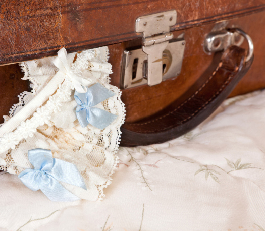 Vintage suitcase and garter