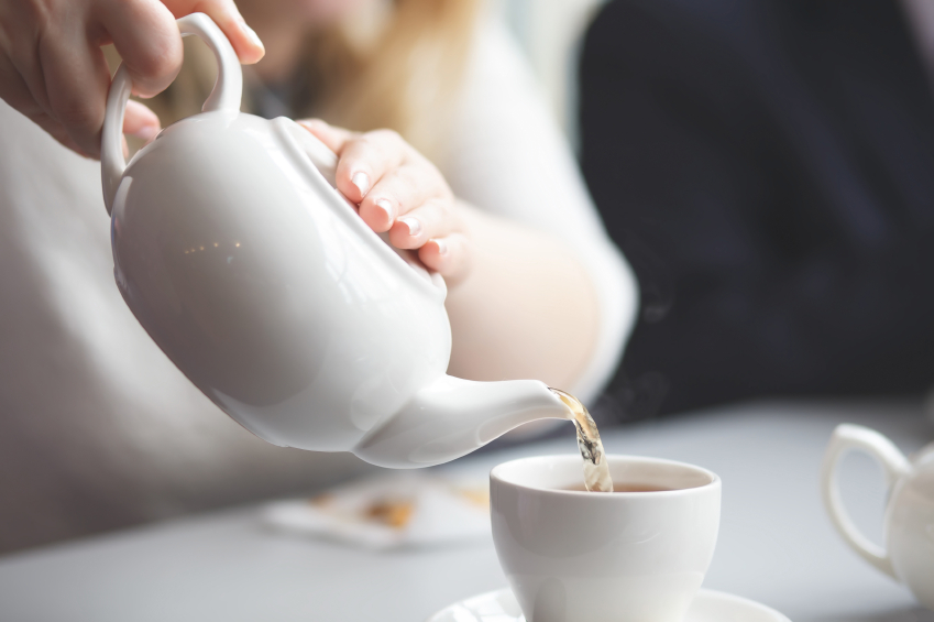 female pouring tea